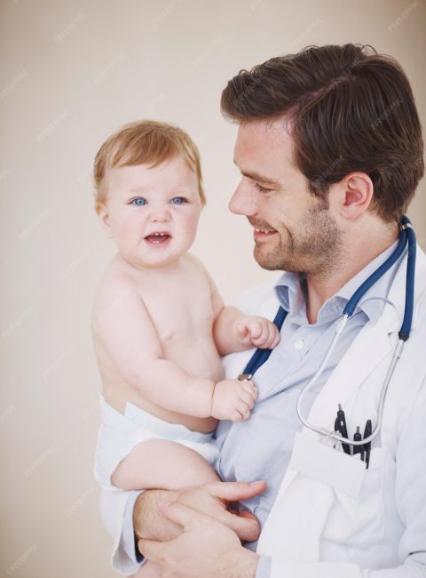isnt-she-just-adorable-male-pediatrician-holding-patient-his-arms_590464-67199